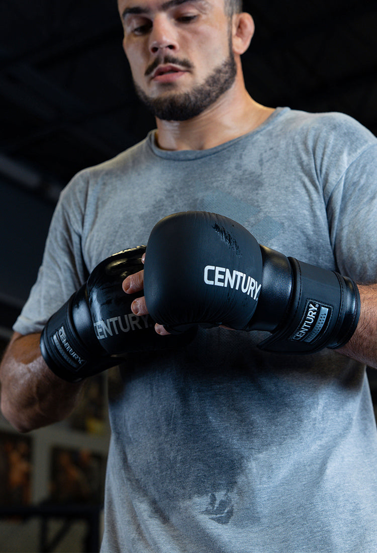 fighter wearing creed gloves