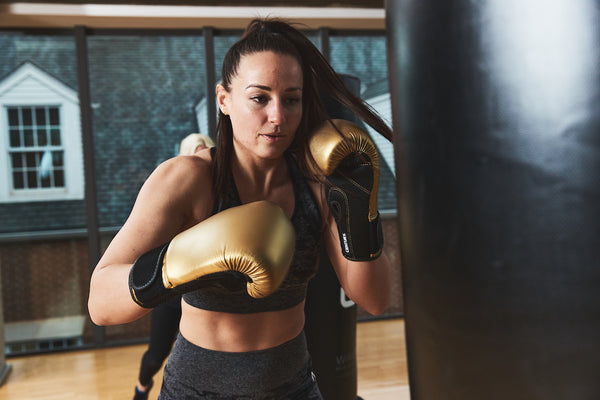 Woman training wearing gloves