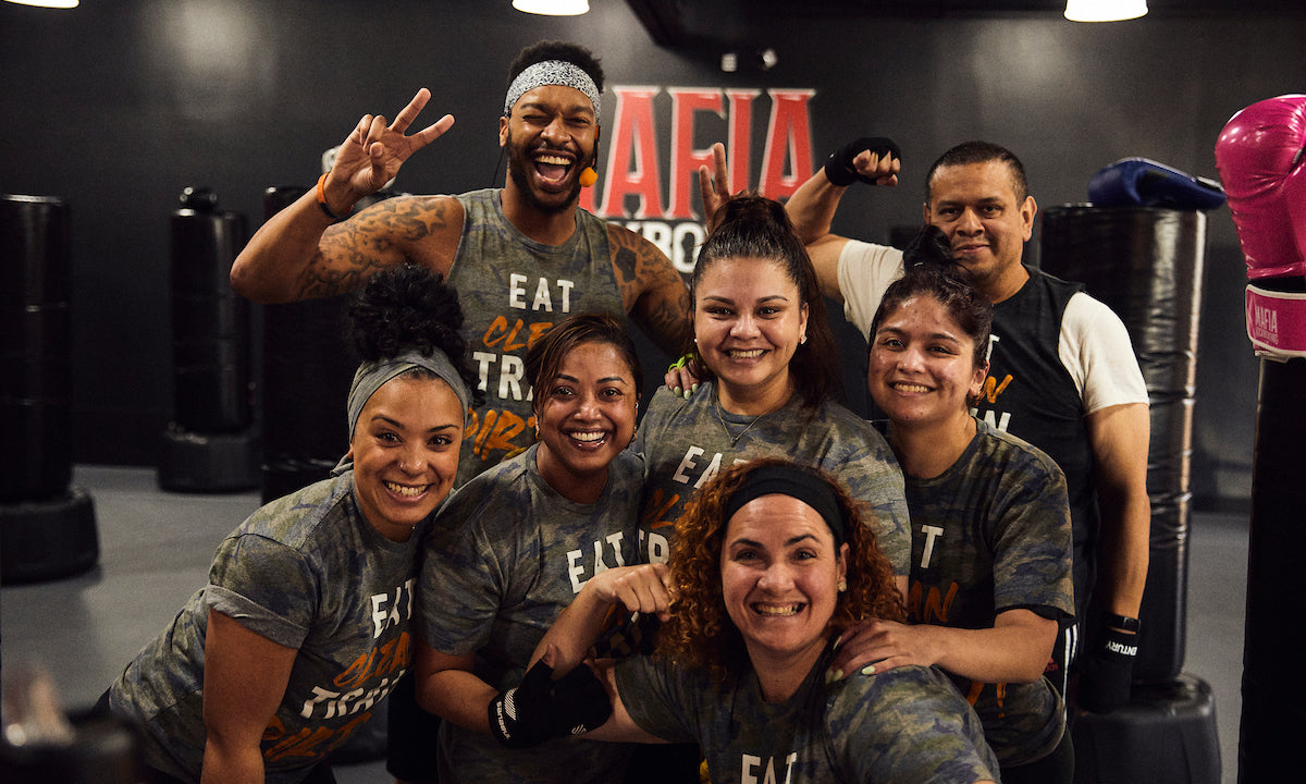 Kickboxing students in class posing