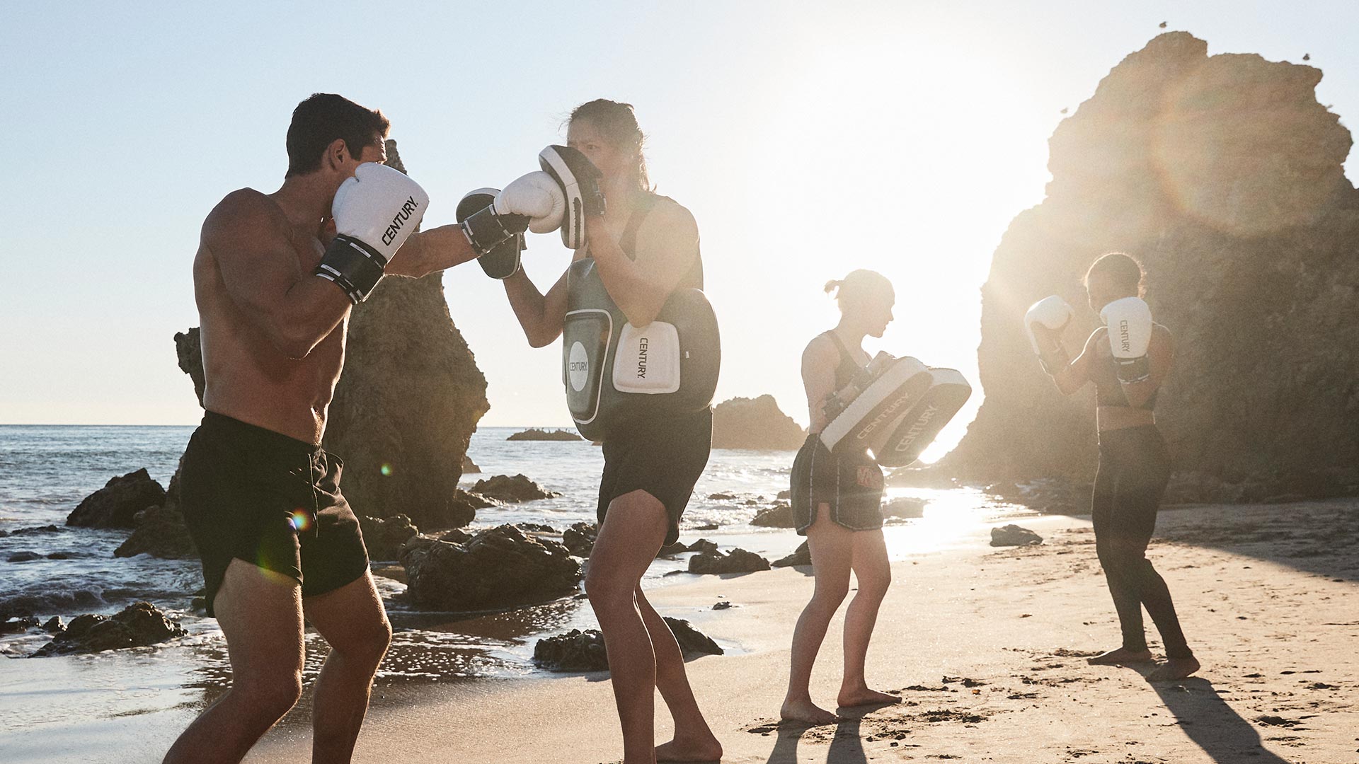 people sparring using century's creed boxing gloves, body shield, and pads