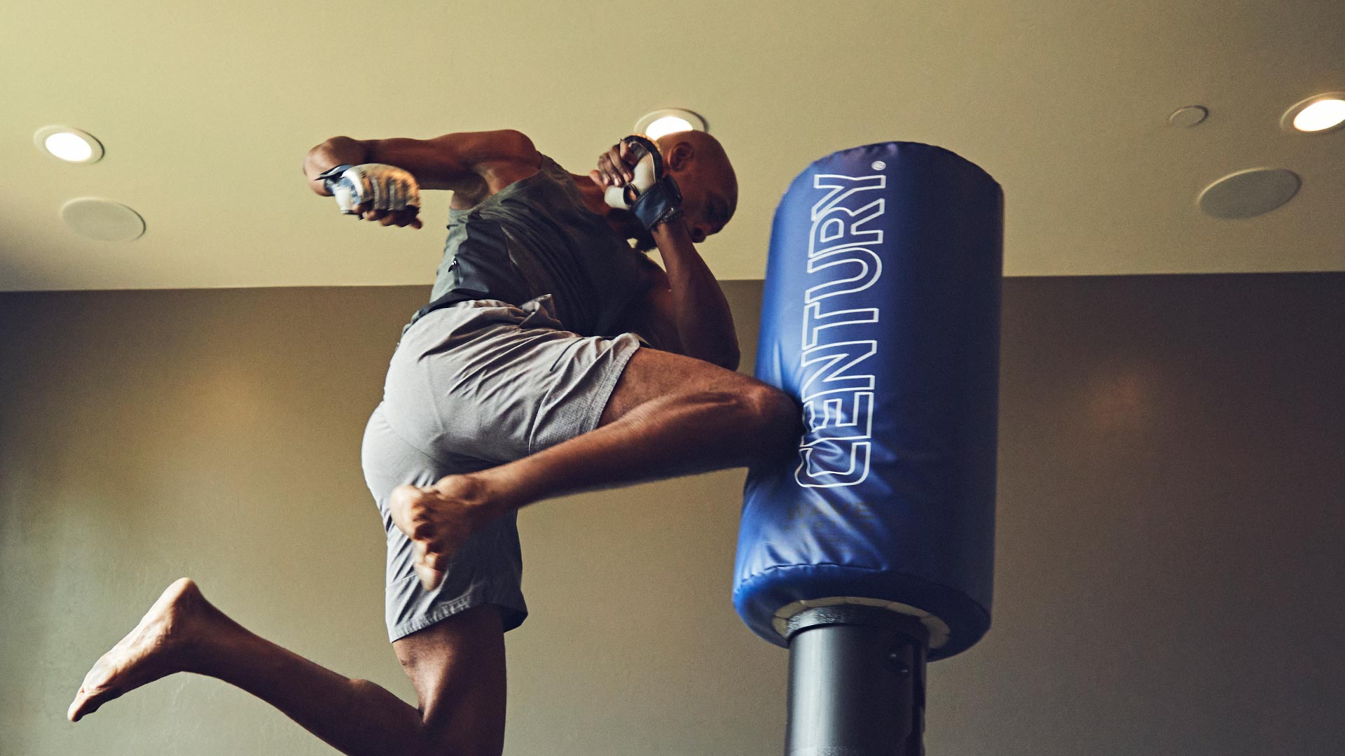 man kicking century kickboxing bag wavemaster original