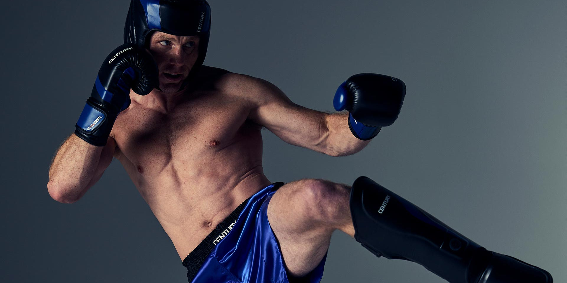 man wearing century's WAKO line of gear, including helmet, gloves, shorts and shin guards