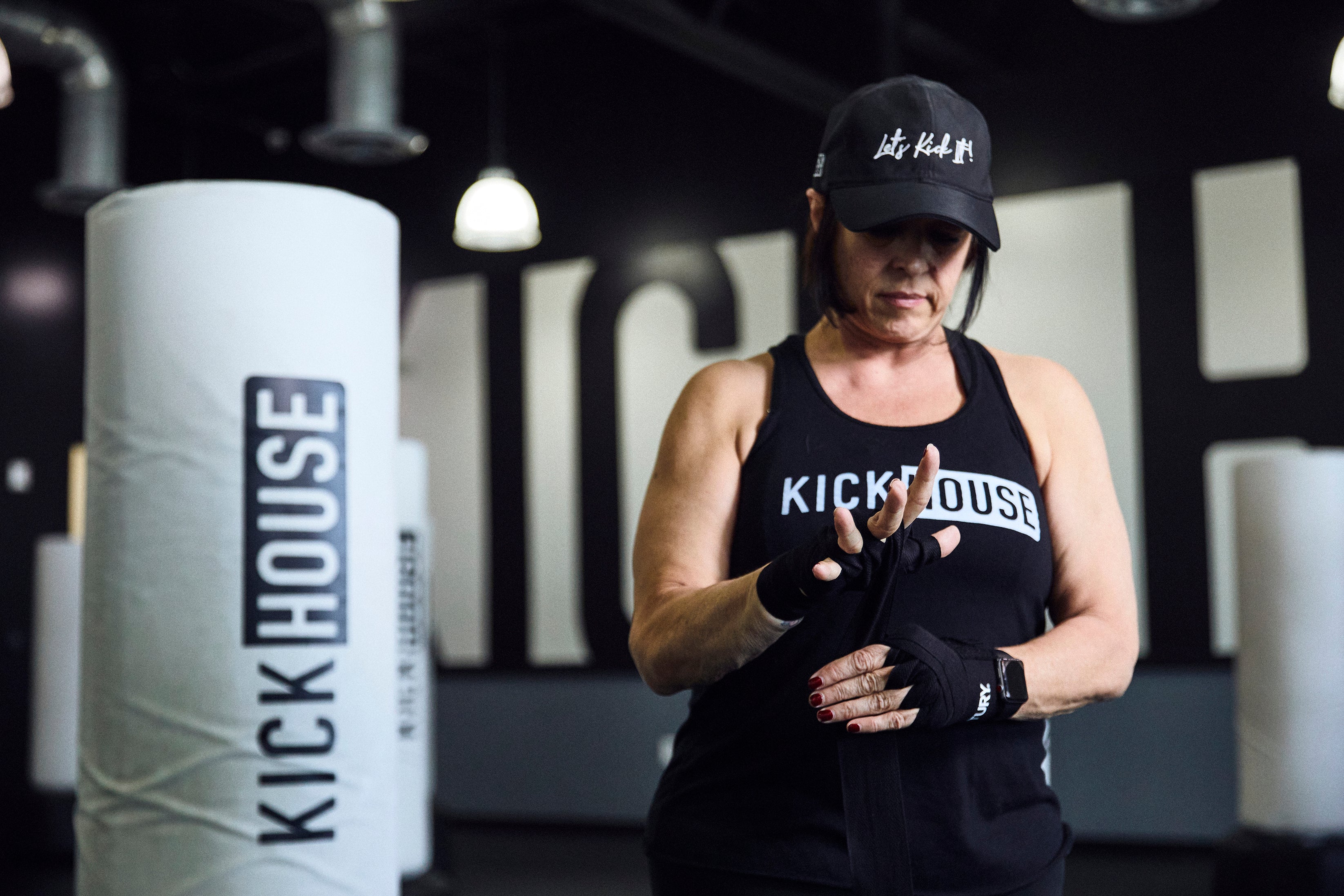 woman wrapping hands for boxing