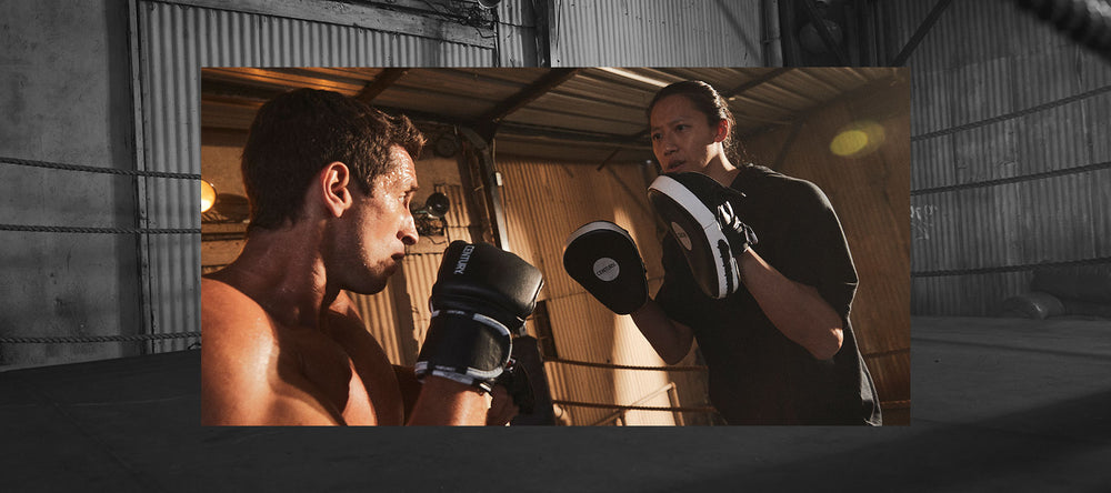 TWO MEN USING TRAINING GEAR