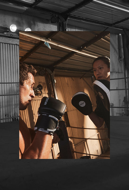 TWO MEN USING TRAINING GEAR 