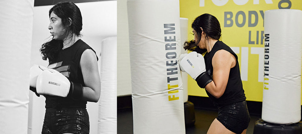 Woman doing boxing workout with custom punching bags