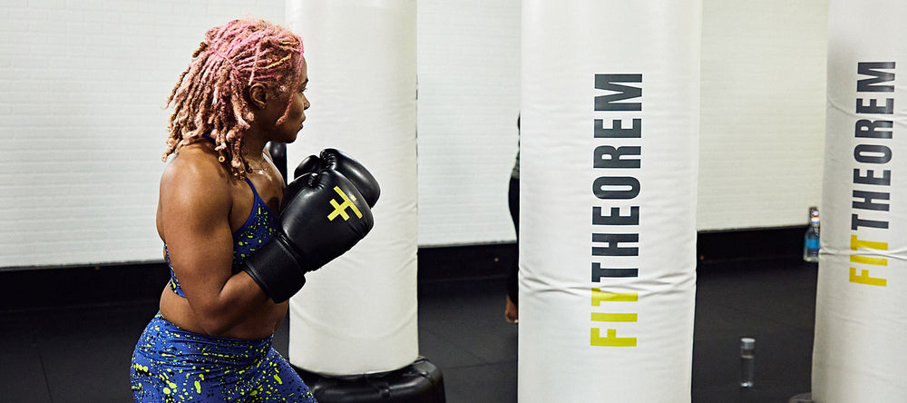 Woman working out on custom punching bags