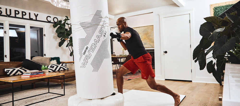 Man punching with white wavemaster punching bag